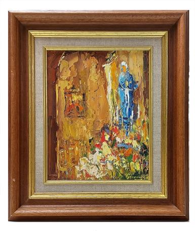 Het Mariabeeld met bloemen aan de voet